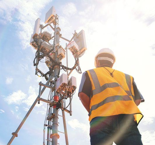 CipherTel technician installing a residential fixed-wireless antenna